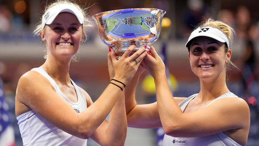 Erin Routliffe and Gabriel Dabrowski smile as they hold their 2023 US Open women's doubles trophy